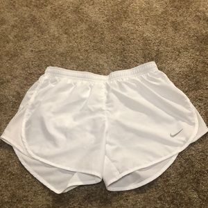 White Nike running shorts